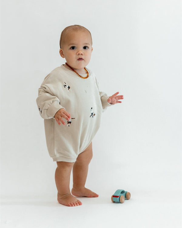 BEIGE SPORTS SWEATER ROMPER